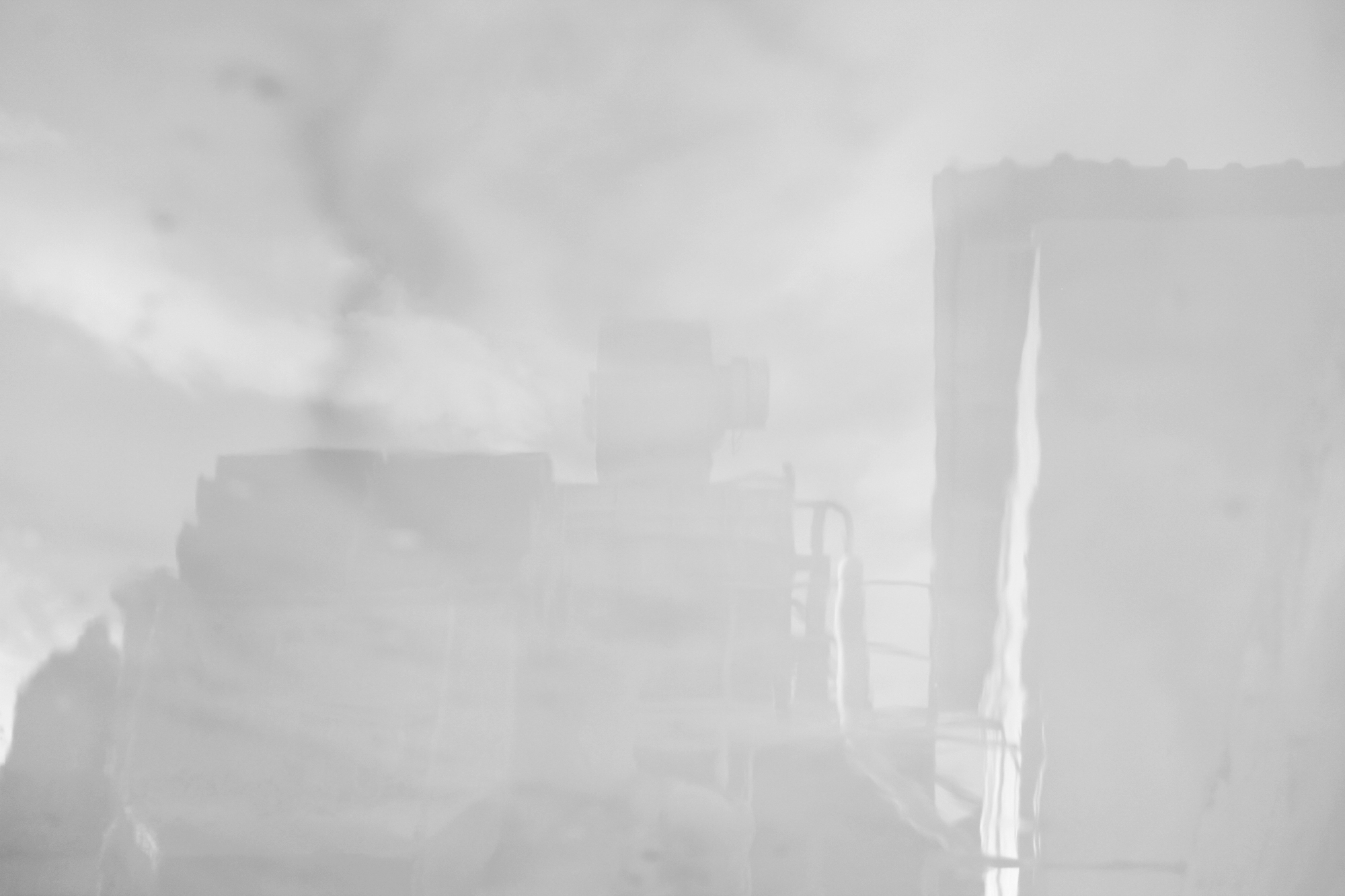 Carina Martins - Eikasia - chimney with smoke reflected in water